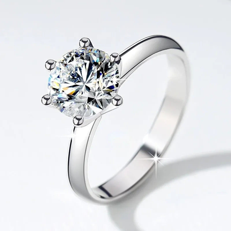 Sterling silver 925 ring with a luxurious 3ct 9mm moissanite gemstone, shining brightly in this elegant jewelry image.