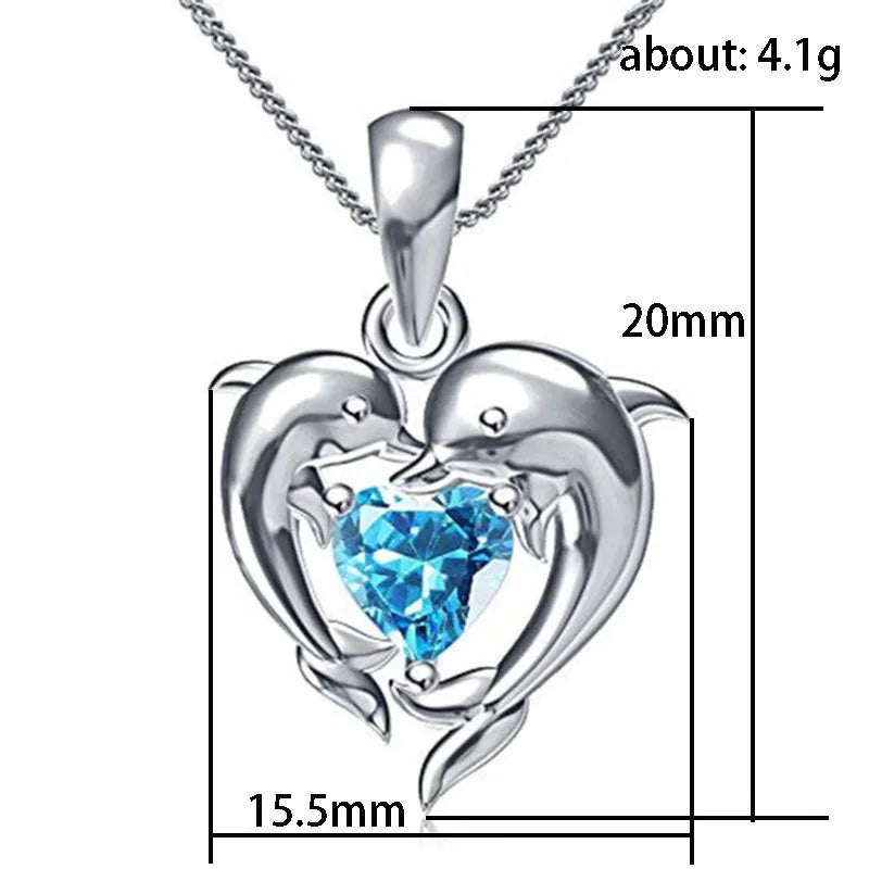 Sterling silver 925 dolphin and heart-shaped pendant necklace, detailed and shiny, crafted by Corporación Turística.