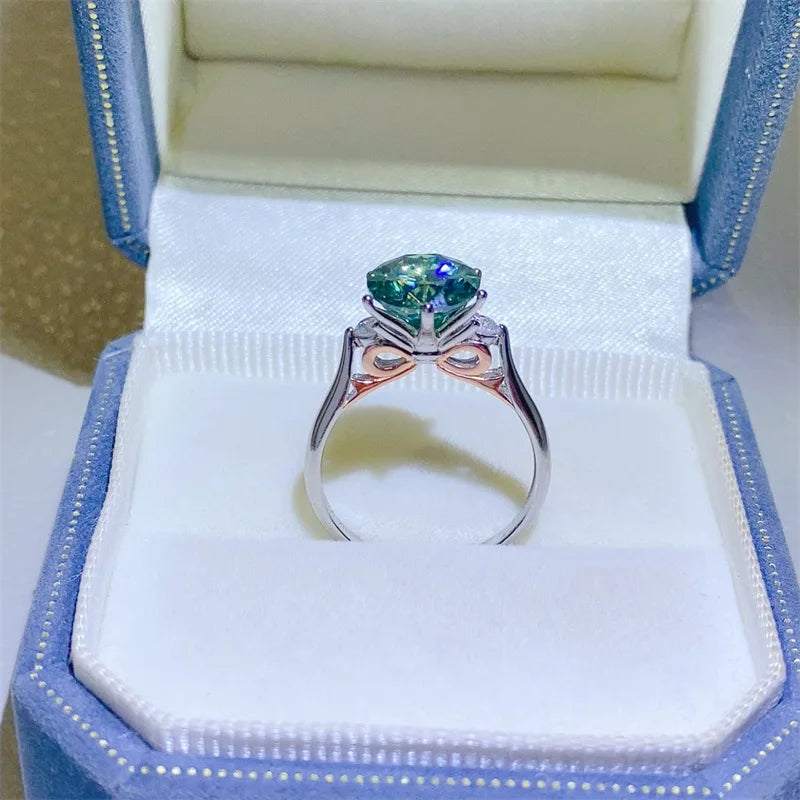 Luxury 18k white platinum moissanite ring with intricate design, featuring a sparkling center stone and polished finish.