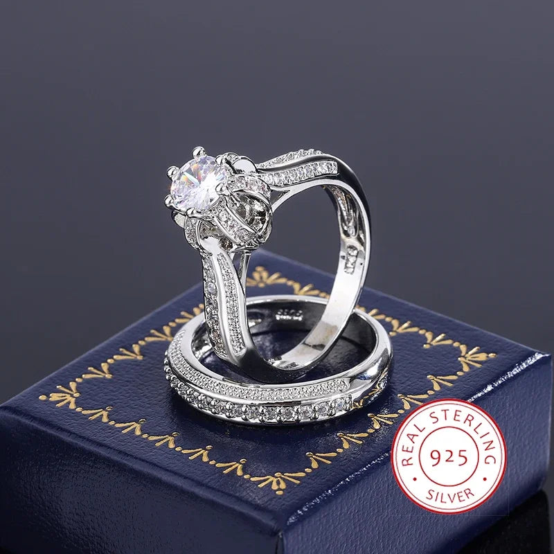 Set of high-quality crystal zircon wedding rings from Corporación Turística, featuring elegant bands with sparkling gemstone accents.