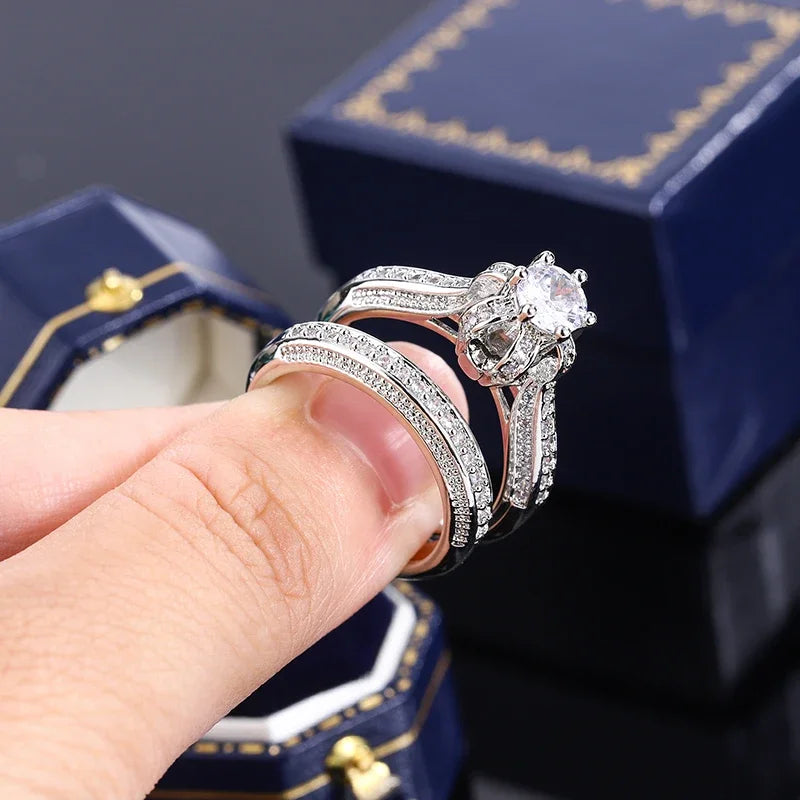 Set of high-quality crystal cubic zirconia wedding rings from Corporación Turística, featuring elegant silver bands and sparkling stones.