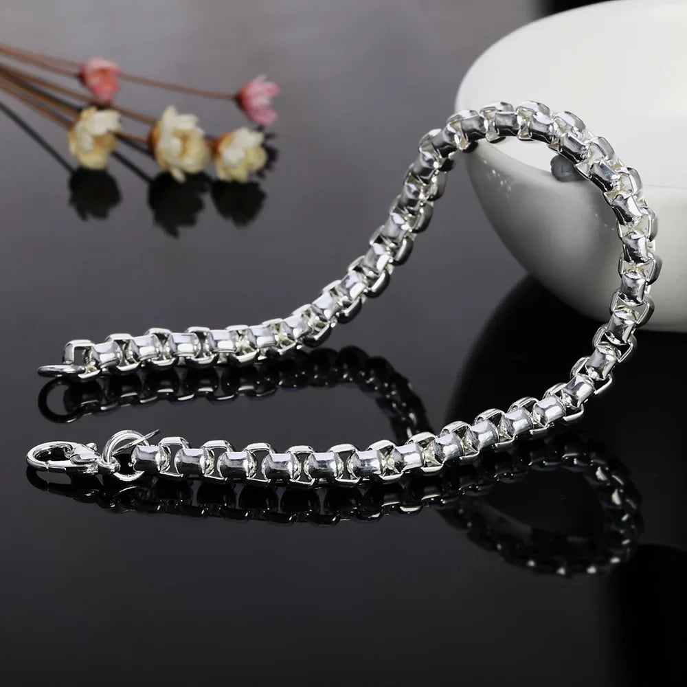 Wholesale 45-60cm sterling silver 925 chain by Corporación Turística, 4mm thick, with jewelry box, displayed on a white background.