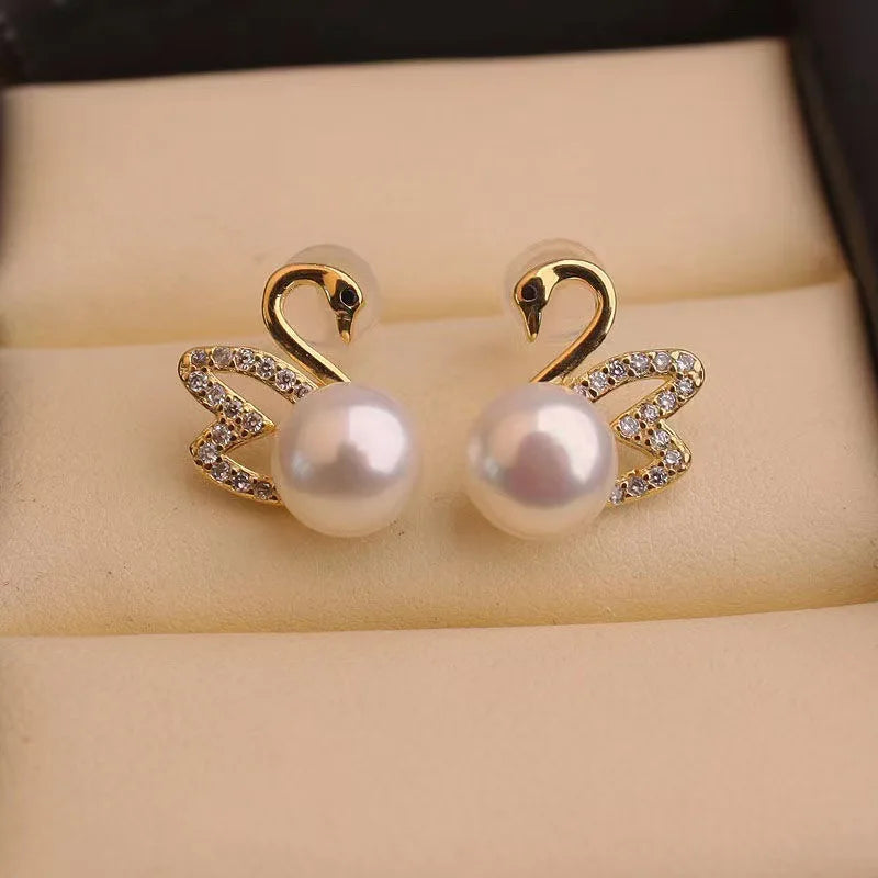 Silver 92% crystal hollow swan earrings featuring needle design, showcasing elegant craftsmanship and sparkling details.