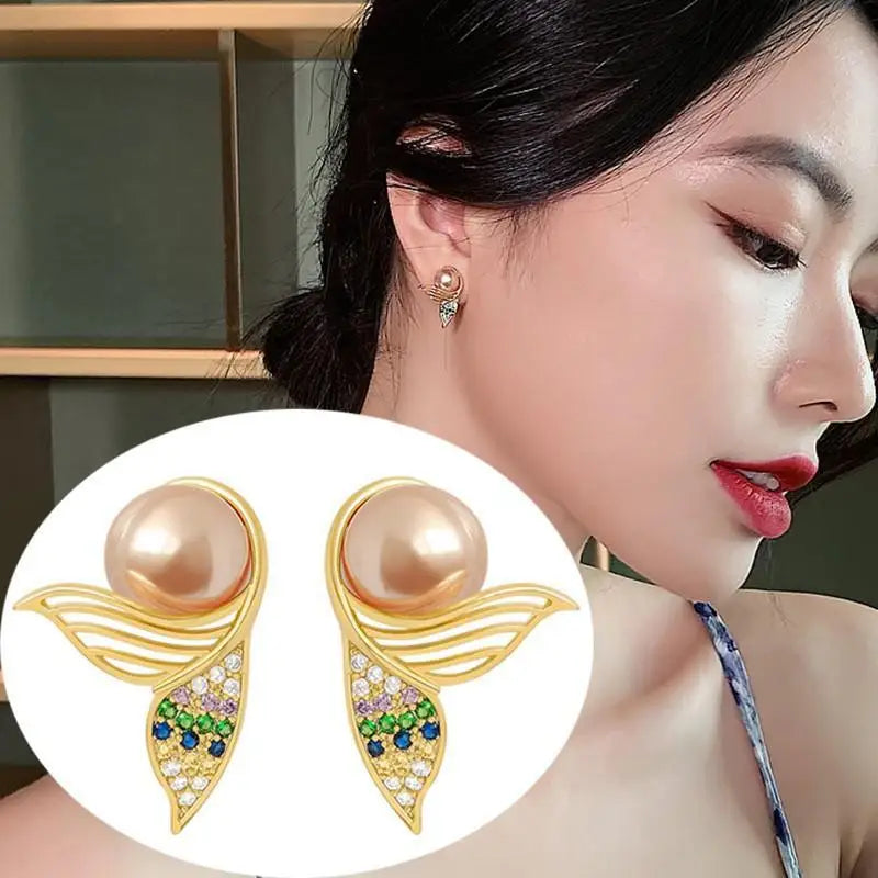 Silver 92% crystal hollow swan earrings featuring needle design, elegant jewelry by Corporación Turística, visible with intricate details.