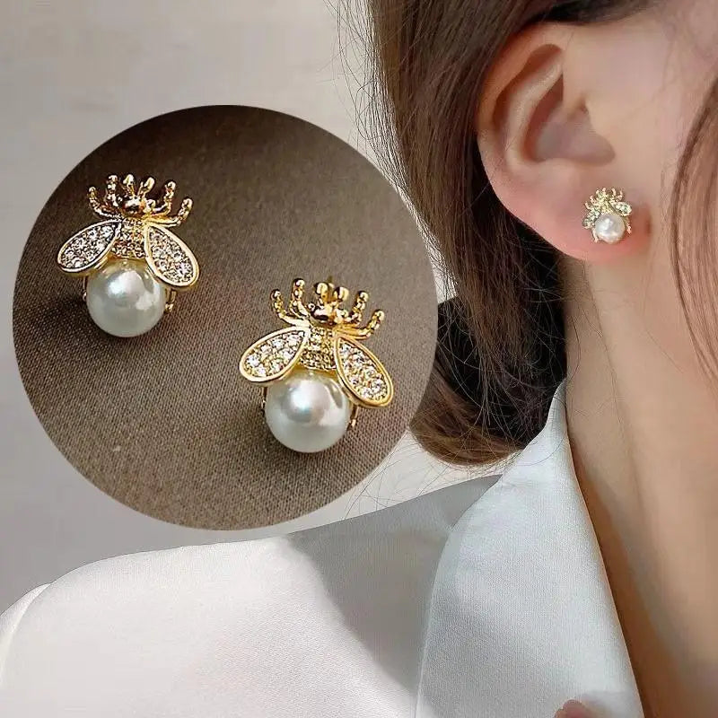 Silver 92% crystal hollow swan earrings with needle design, featuring elegant green accents, ideal for stylish accessories.
