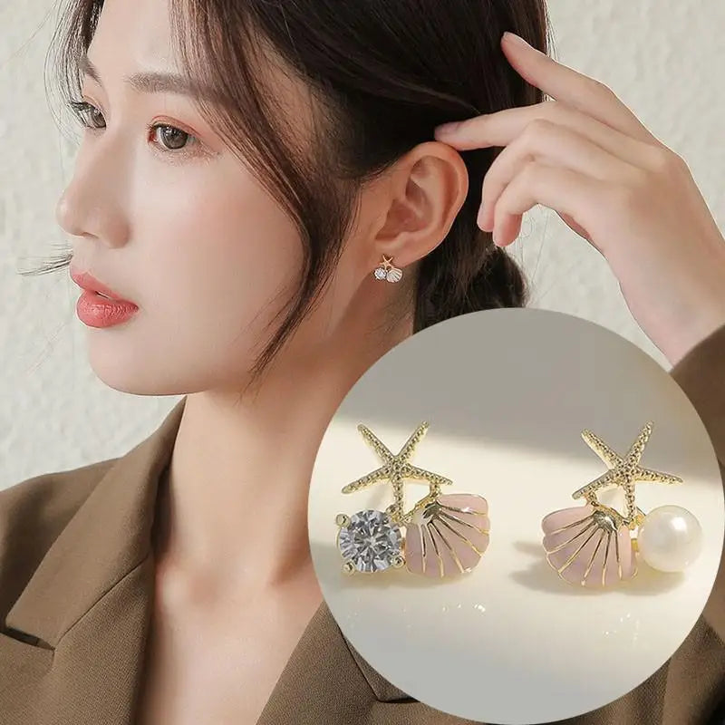 Silver needle and hollow crystal swan earrings with green accents, elegant jewelry by Corporación Turística.