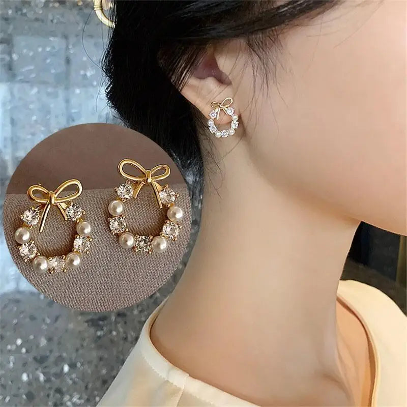 Silver 92% crystal hollow swan earrings with needle design, featuring intricate craftsmanship and elegant green accents.