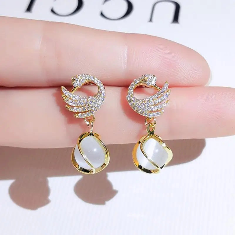 Purple crystal heart drop earrings for women, featuring elegant dangling design and vibrant gemstone details.