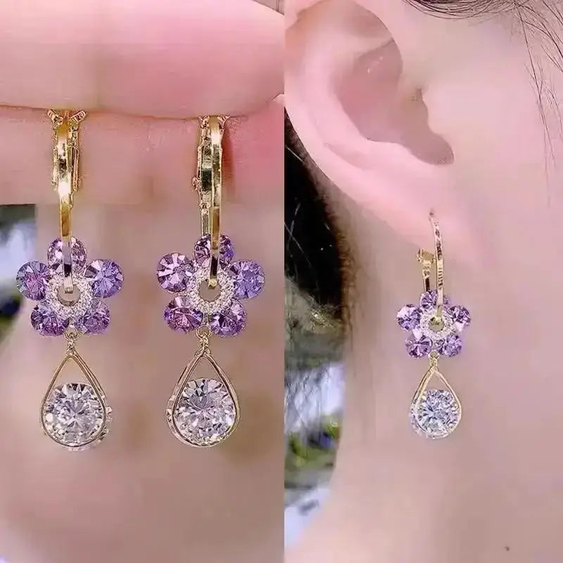 Purple crystal heart drop earrings for women, elegant jewelry by Corporación Turística, featuring dangling gemstone design.