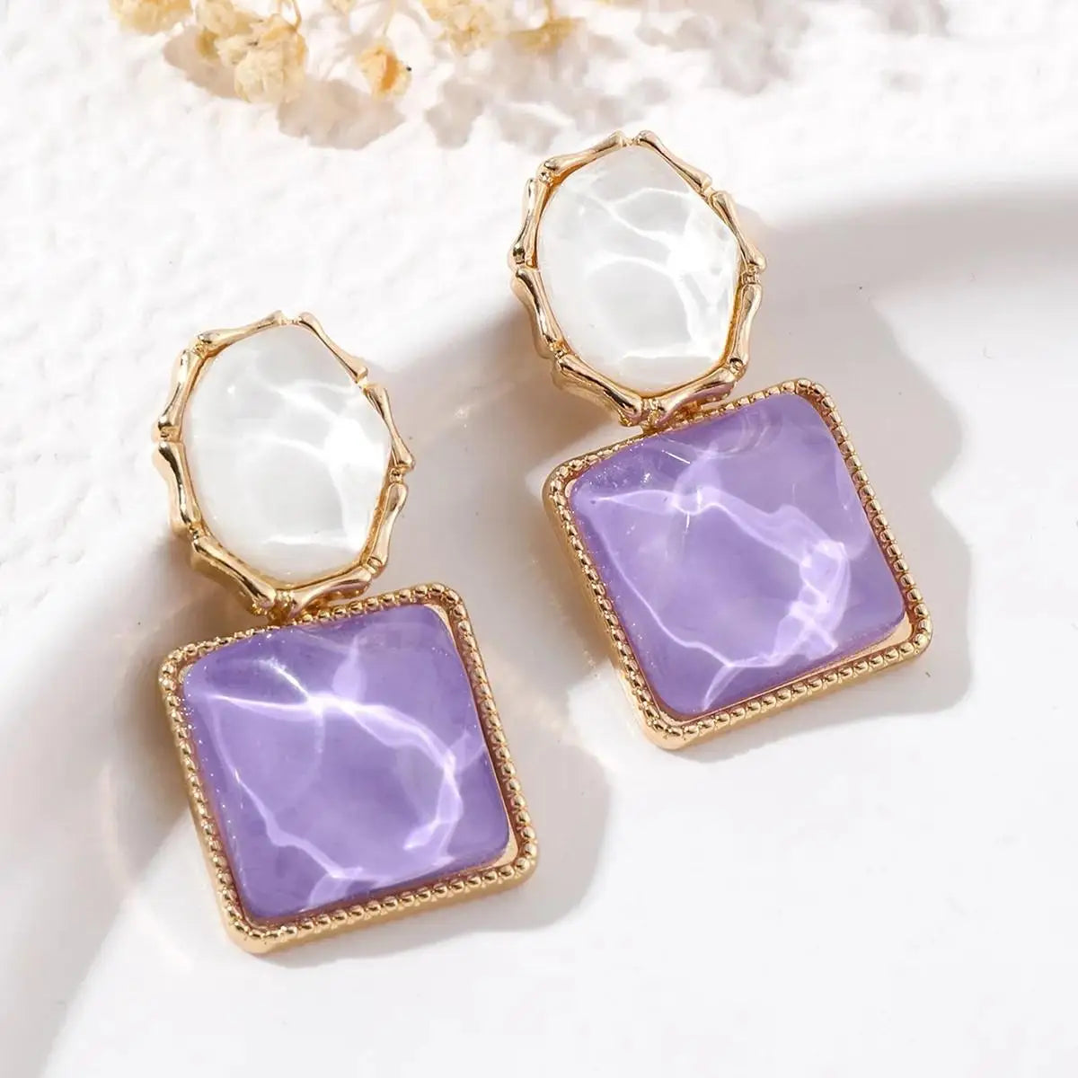Purple crystal heart drop earrings for women, featuring elegant teardrop-shaped design by Corporación Turística.