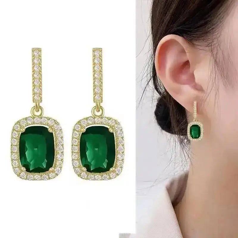 Purple crystal heart drop earrings for women, featuring elegant teardrop design, by Corporación Turística.