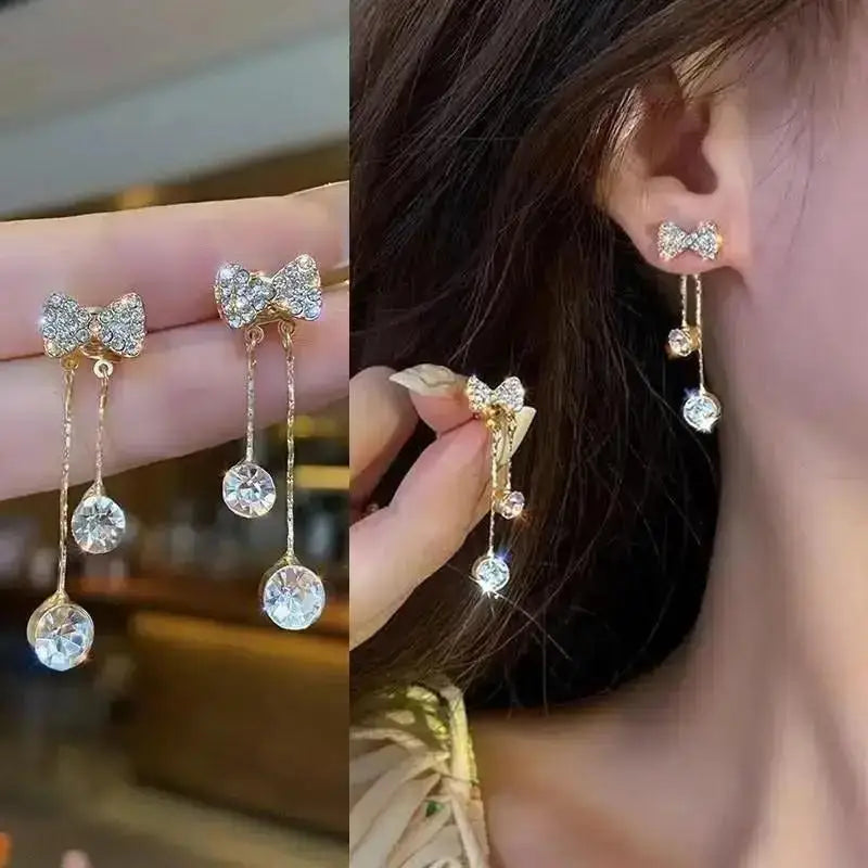 Korean-style pearl tassel earrings with needle hook, featuring 5mm clear crystals and elegant fashion design.