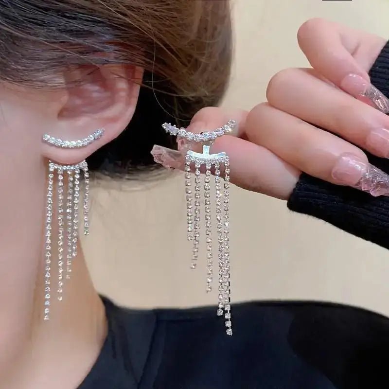 Korean-style pearl tassel earrings with needle detail, featuring 5mm clear crystals and elegant design from Corporación Turística.