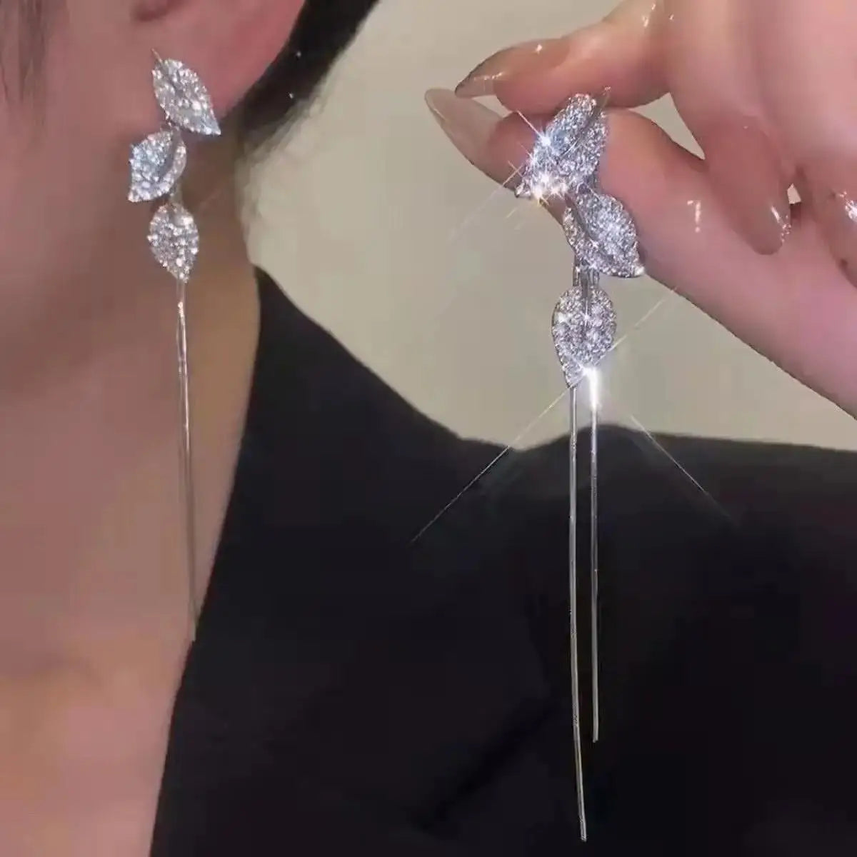 Korean-style pearl tassel earrings with crystal accents and needle hook, stylish jewelry from Corporación Turística.