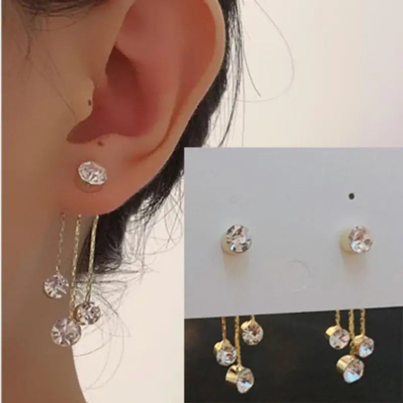 Korean fashion pearl tassel earrings with needle detail, featuring 5mm crystals and elegant design, by Corporación Turística.