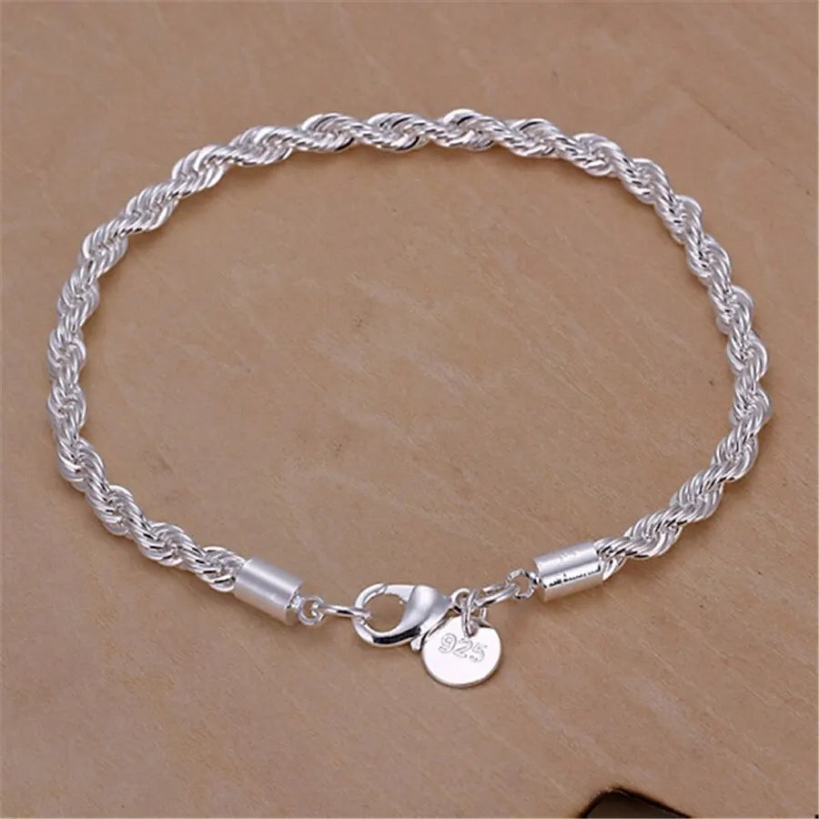 Men's silver 4mm braided rope chain collar, 55cm and 20cm lengths, from Corporación Turística, displayed on a white background.