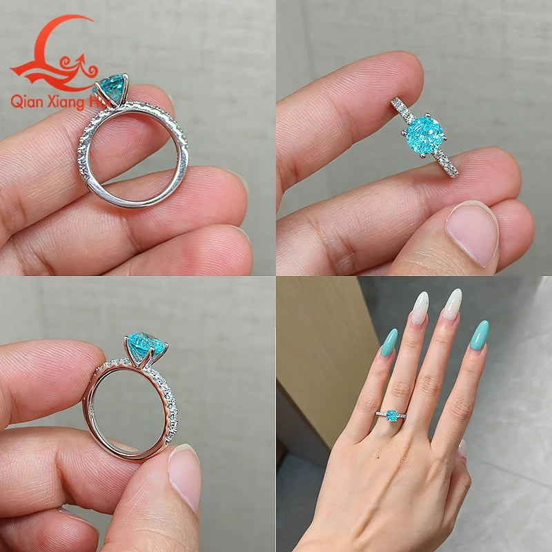 Silver ring with neon blue Paraiba tourmaline and greenish hues, featuring a 6.5mm YAG gemstone setting.