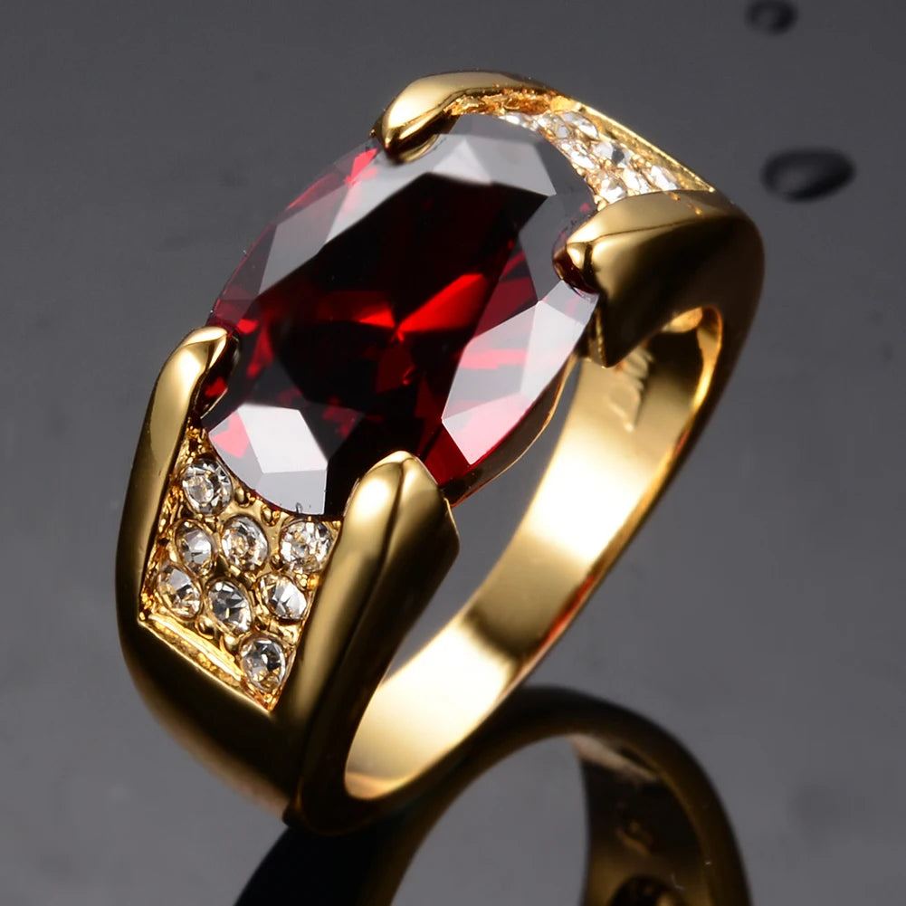 Elegant red crystal ring with oval zirconia, luxurious jewelry piece from Corporación Turística, showcasing intricate design.