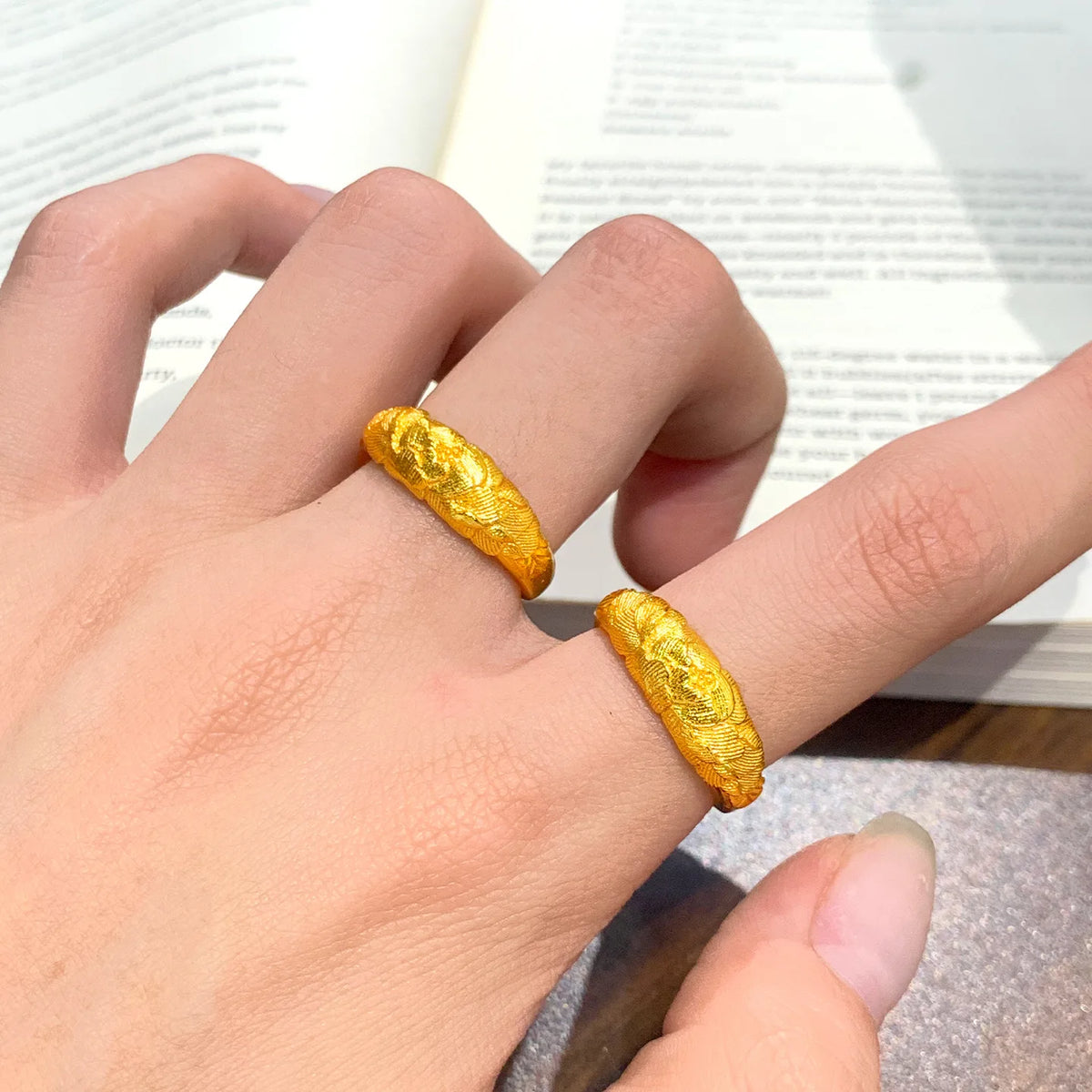 Gold solid ring with intricate peony relief design for women, showcasing detailed craftsmanship and floral motif.
