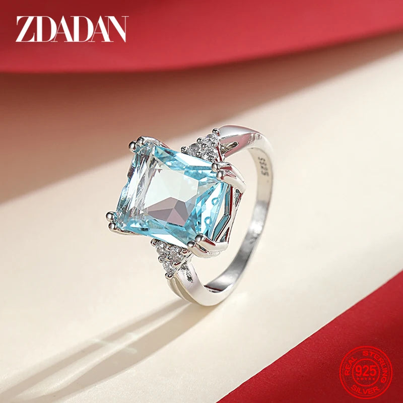 Elegant ZDADAN aquamarine gemstone ring for women, featuring a silver band and sparkling blue stones.