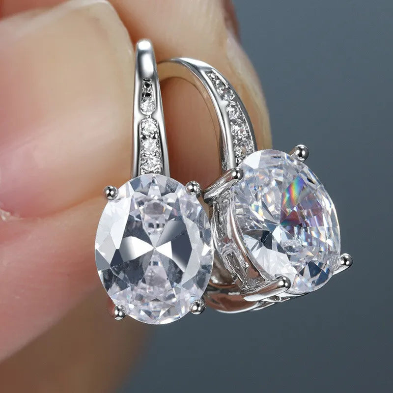 Sterling silver 925 earrings with intricate circular inlay, showcasing detailed craftsmanship and elegant design.