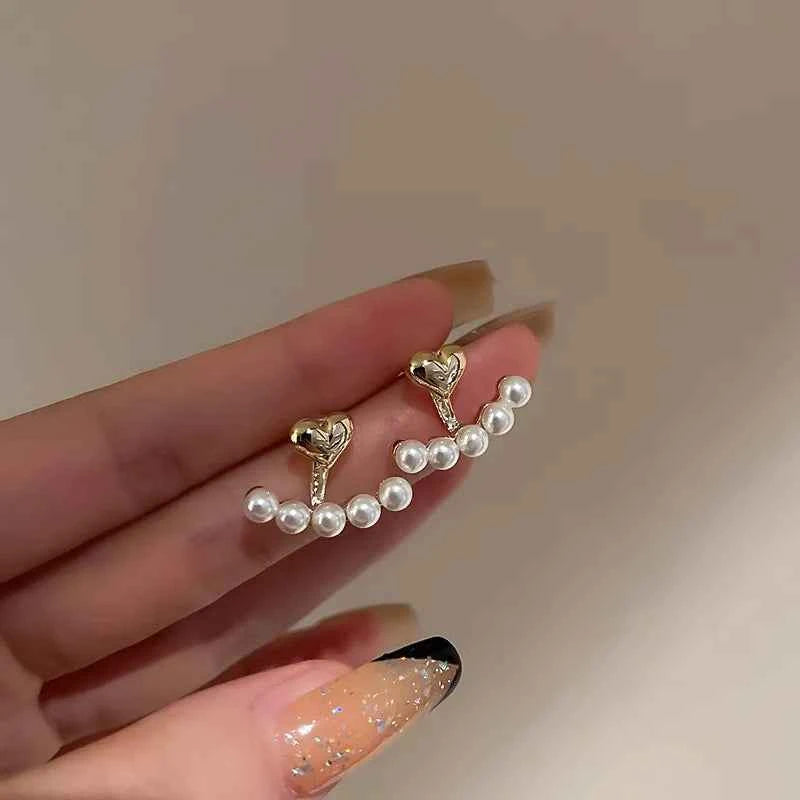 Elegant gold earrings from WUKALO 2024, featuring stylish design and polished finish, perfect for sophisticated looks.