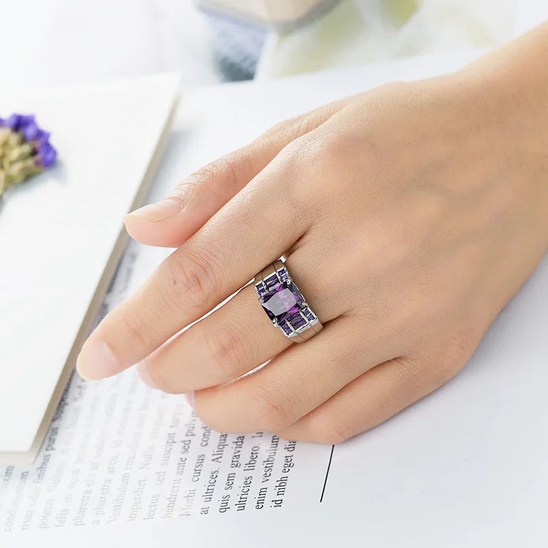 Wide purple cubic zirconia ring for women, stylish and elegant jewelry piece, featuring a bold band and sparkling stones.
