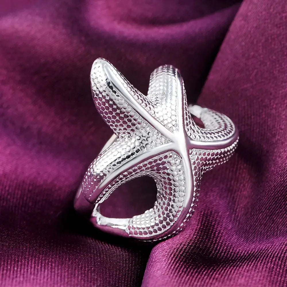 Large sterling silver starfish rings by Corporación Turística, featuring fine craftsmanship and detailed ocean-inspired design.