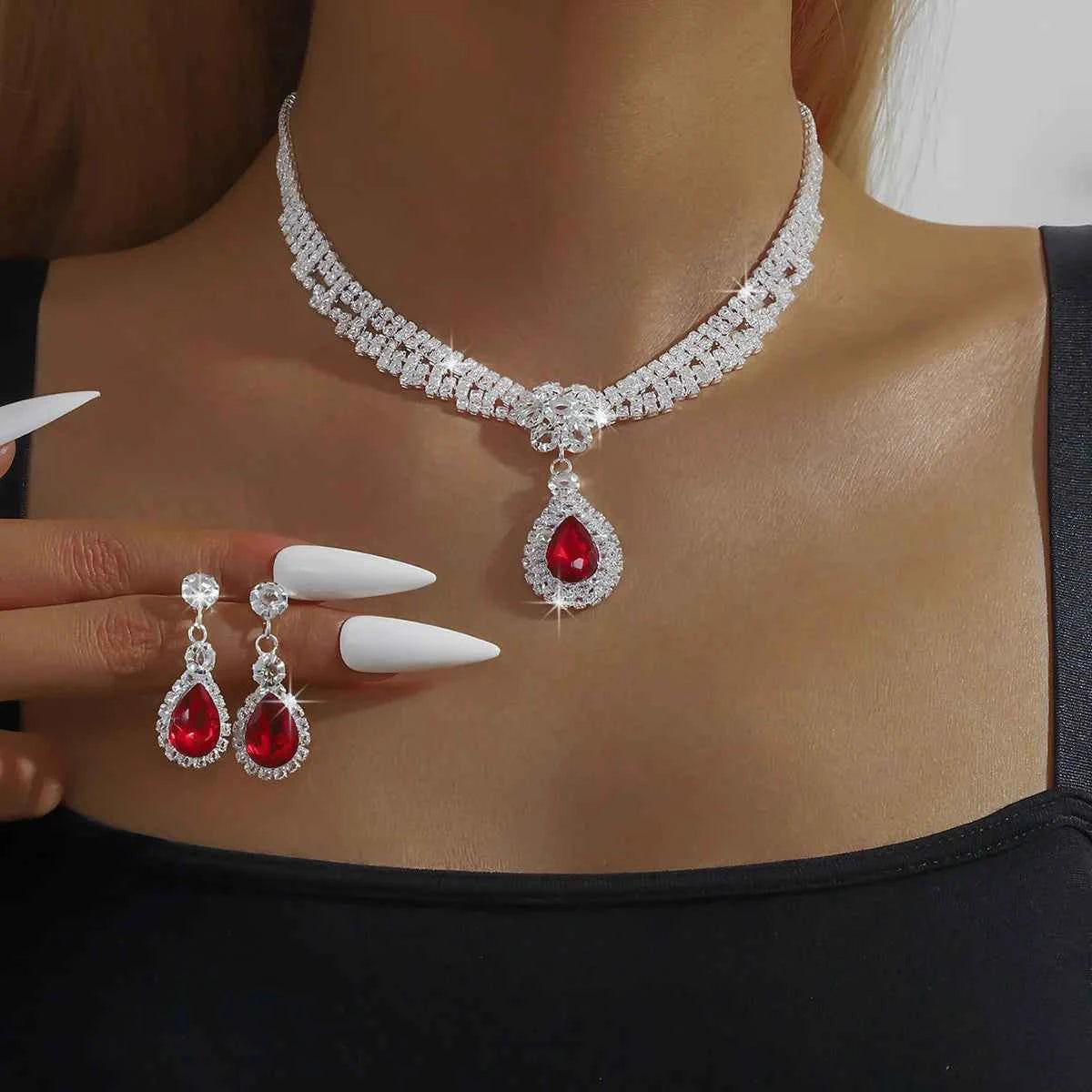 Silver jewelry set for women featuring a floral gold necklace with matching earrings, elegant and detailed design.