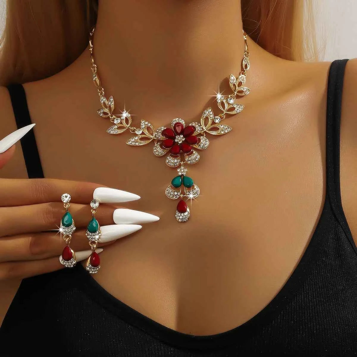 Silver floral jewelry set for women featuring a gold-tone necklace with flower designs, perfect for elegant occasions.