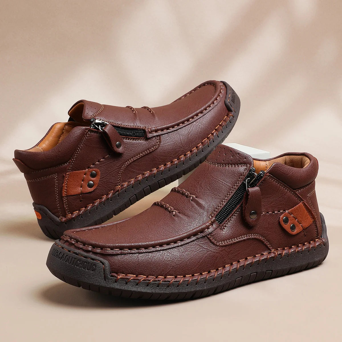 Light brown men's leather classic boots with a sleek design, suitable for casual and sporty occasions.