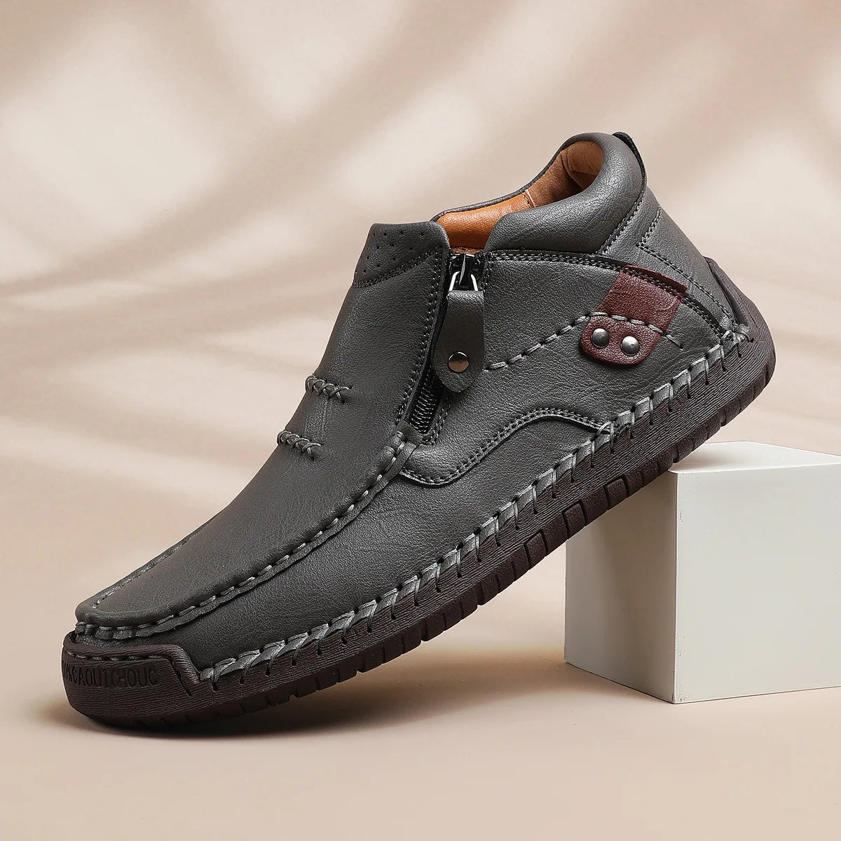 Light brown men's leather classic boots from Corporación Turística, featuring a stylish design and sturdy sole.