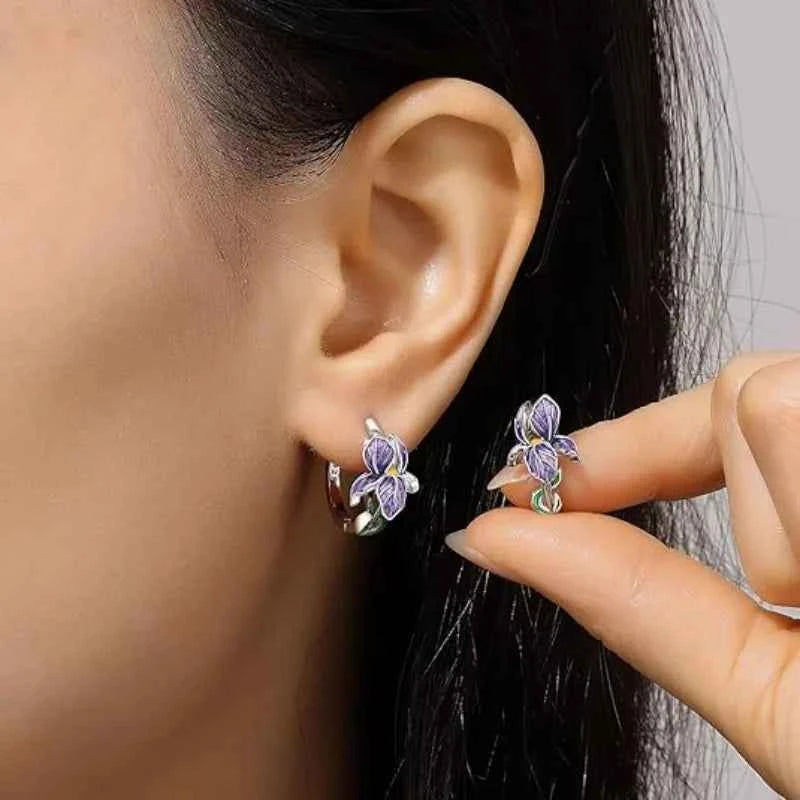 Sterling silver earrings with floral and iris design, crafted by Corporación Turística. Elegant jewelry for special occasions.