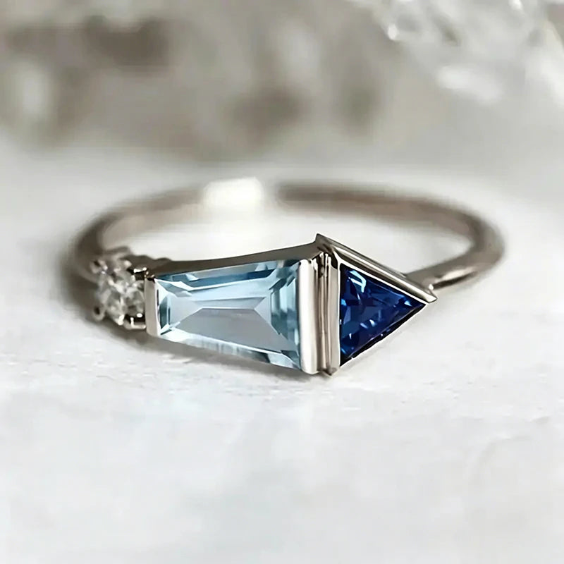 Blue cubic zirconia geometric finger ring by Corporación Turística, stylish silver-tone design for everyday wear.
