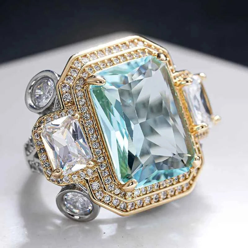 Blue cubic zirconia rectangular rings by Huitan, featuring sleek silver bands, perfect for elegant jewelry looks.