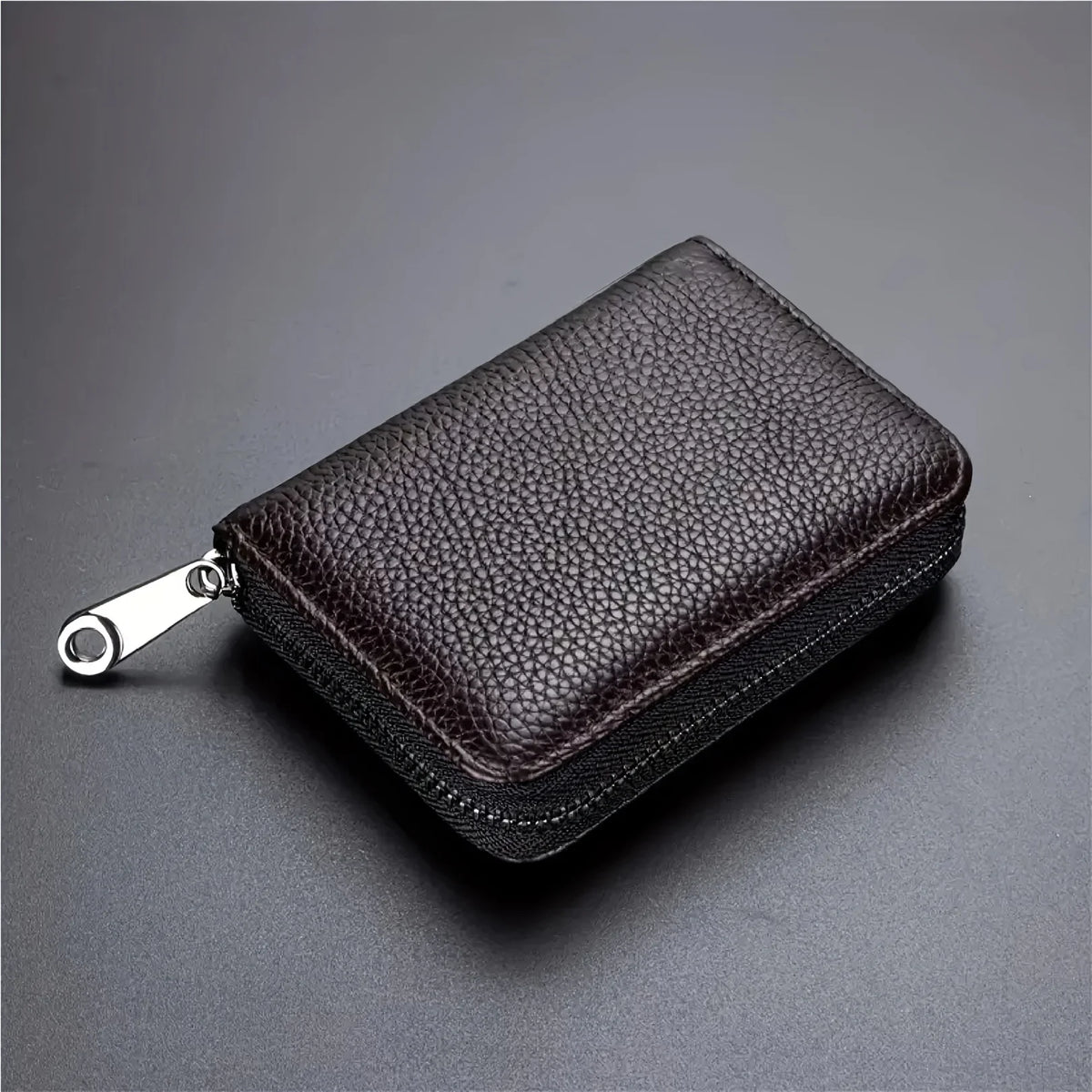 Black RFID unisex wallet with card holder and zipper, compact and elegant, from Corporación Turística, designed for secure card storage.