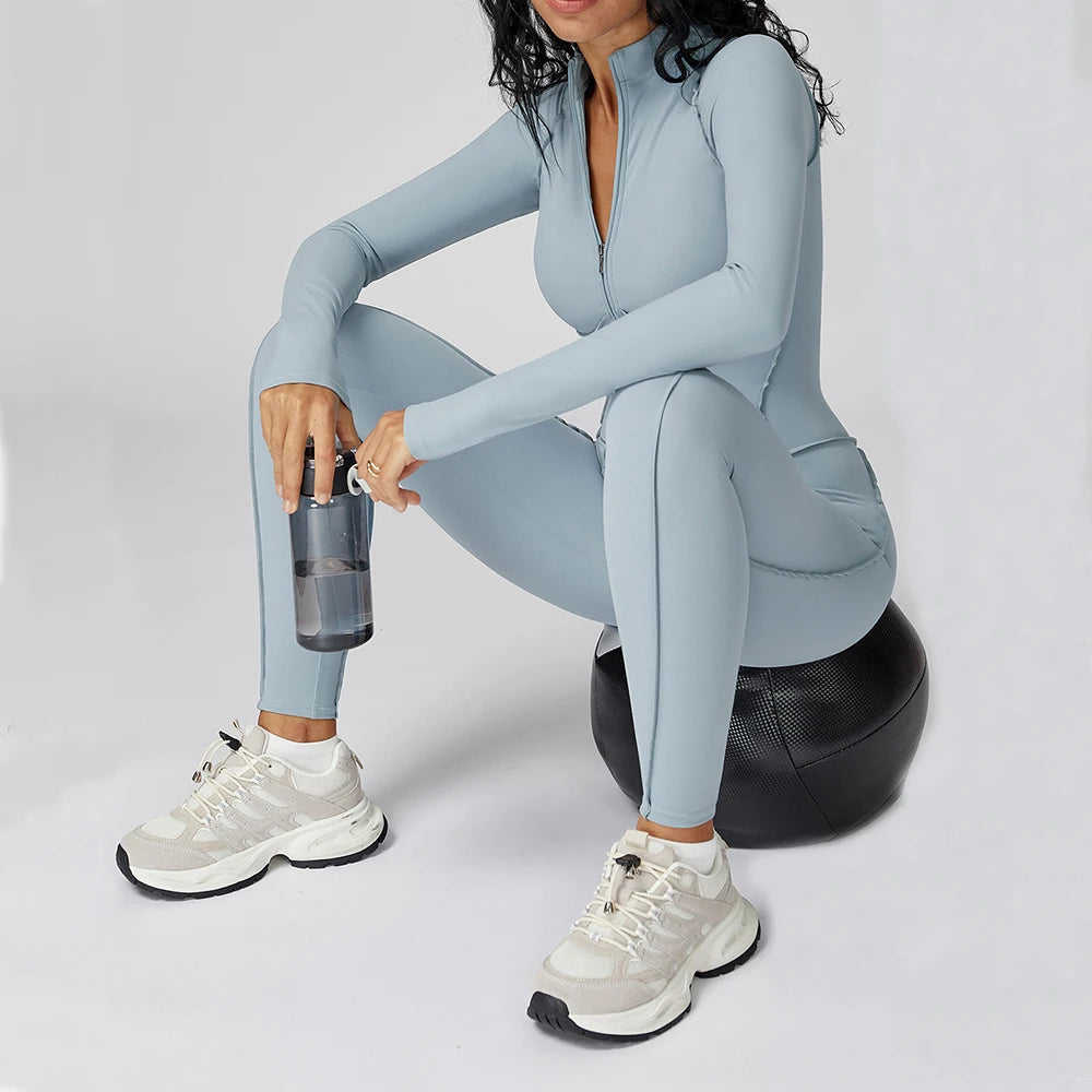 Black women's yoga bodysuit by Corporación Turística, high elasticity, form-fitting athletic one-piece for yoga and active wear.