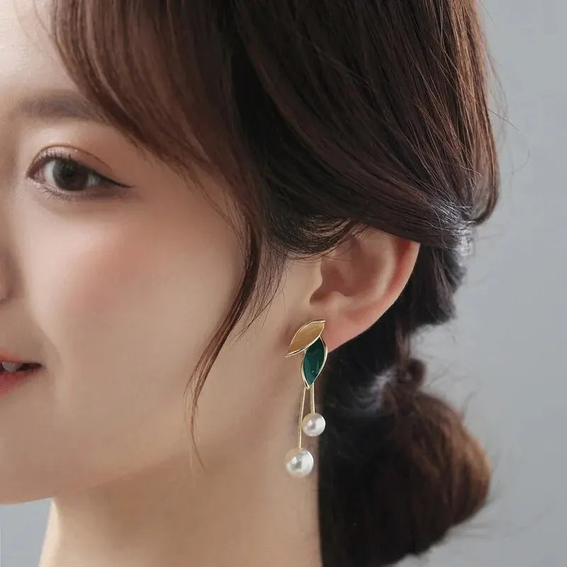 Imitation pearl drop earrings for women featuring elegant hanging design, crafted by Corporación Turística.