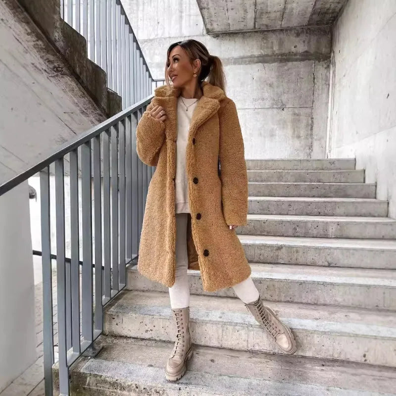 Long women's autumn and winter coat by Corporación Turística in apricot color, stylish and warm for cold weather.