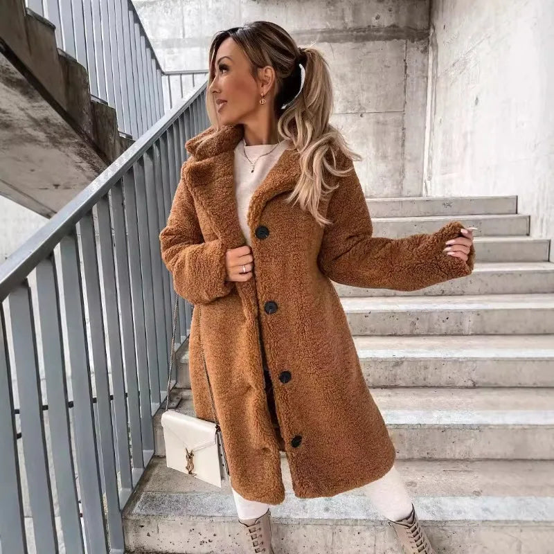 Long women's autumn and winter coat in apricot from Corporación Turística, stylish and warm outerwear for cold weather.