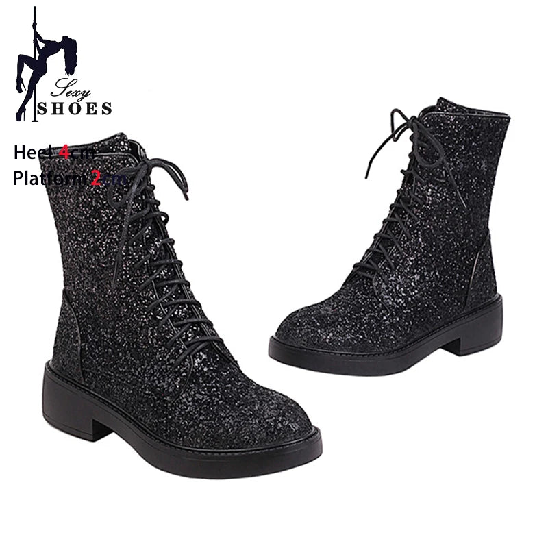 Bright shiny women's ankle boots by Corporación Turística, casual slip-on shoes with a sleek, fashionable design.