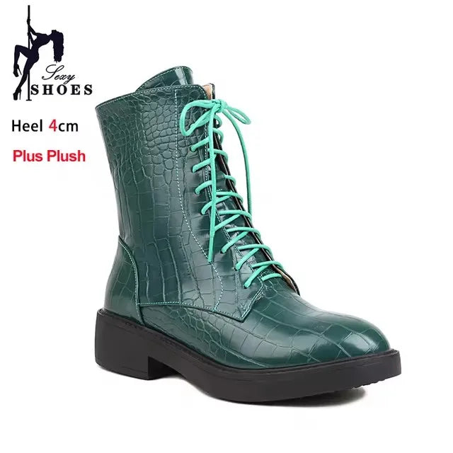 Pair of women's boots with side zipper from Corporación Turística, featuring a sleek design and ankle-high style.