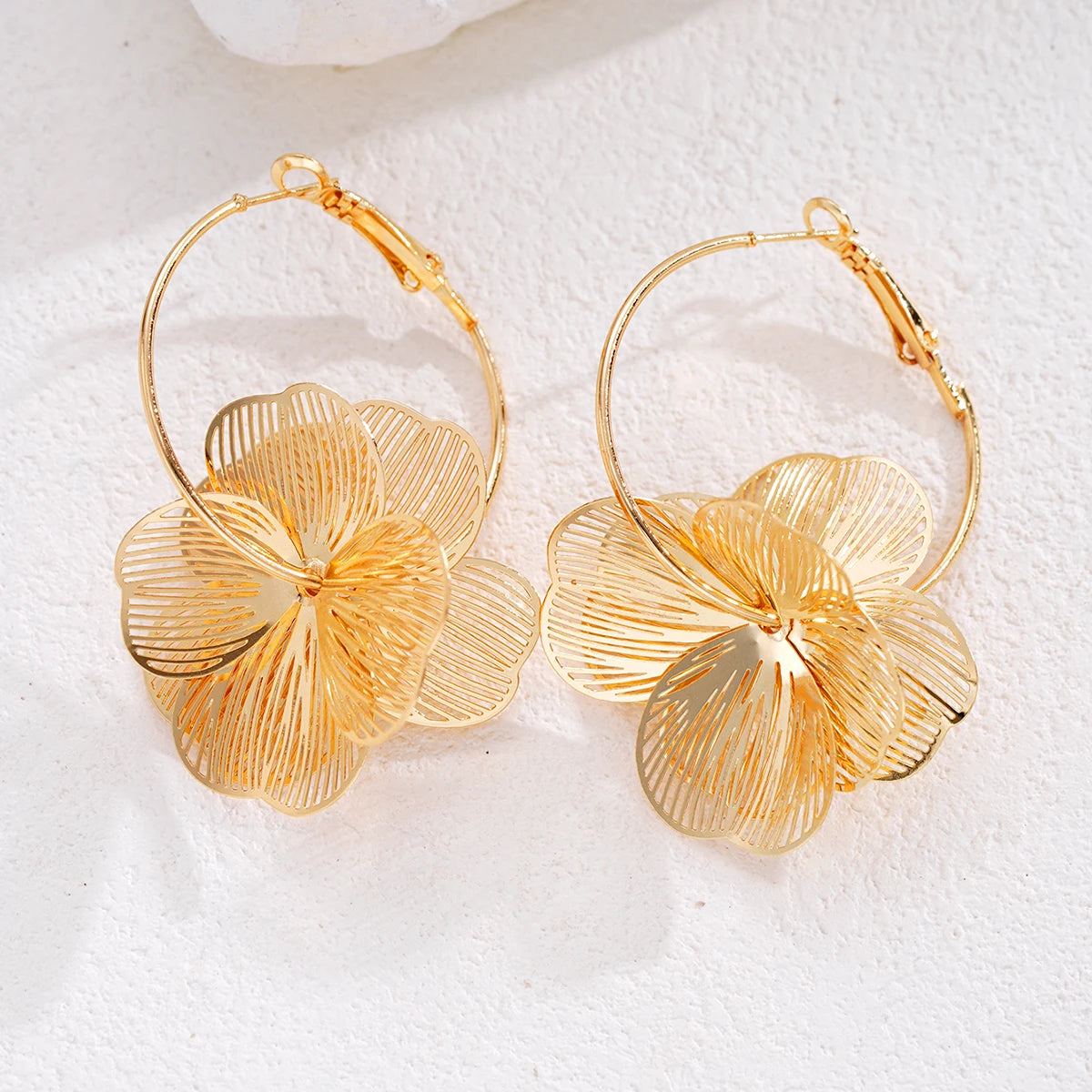Elegant vintage double petal earrings for women, featuring intricate gold-tone design and feminine charm.