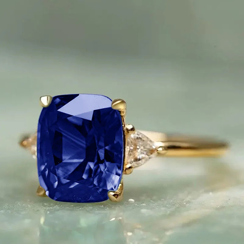 14K gold ring with a natural blue sapphire for women, featuring a elegant design and a polished finish.