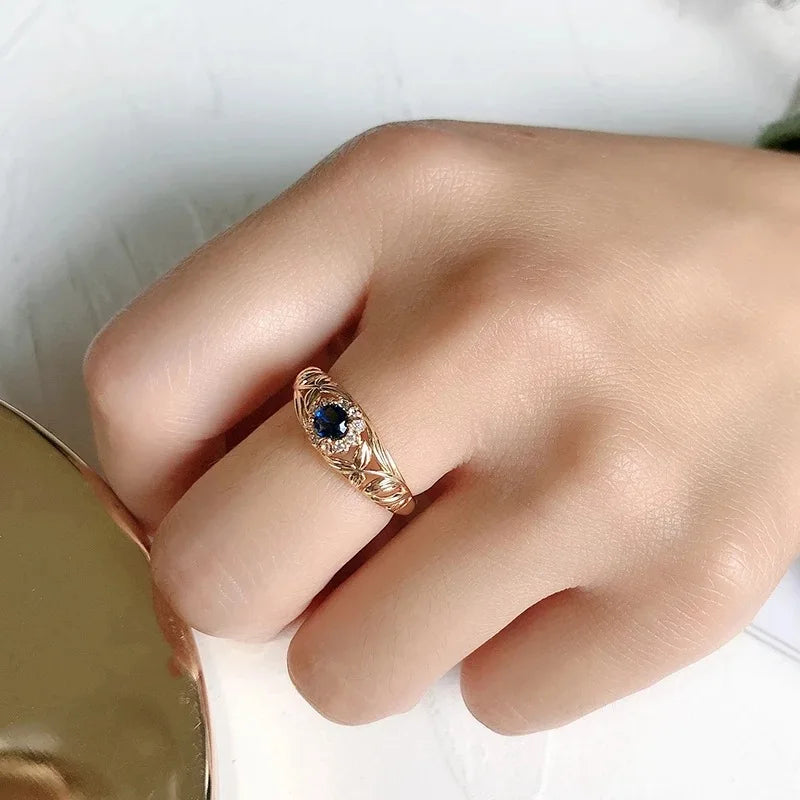 14k gold ring with diamonds for women, showcasing a sleek design with sparkling gemstones, by Corporación Turística.