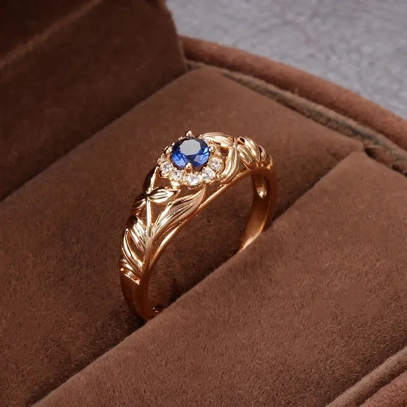 14k gold genuine diamond ring for women, featuring a sleek band and sparkling diamonds, displayed on a blue background.