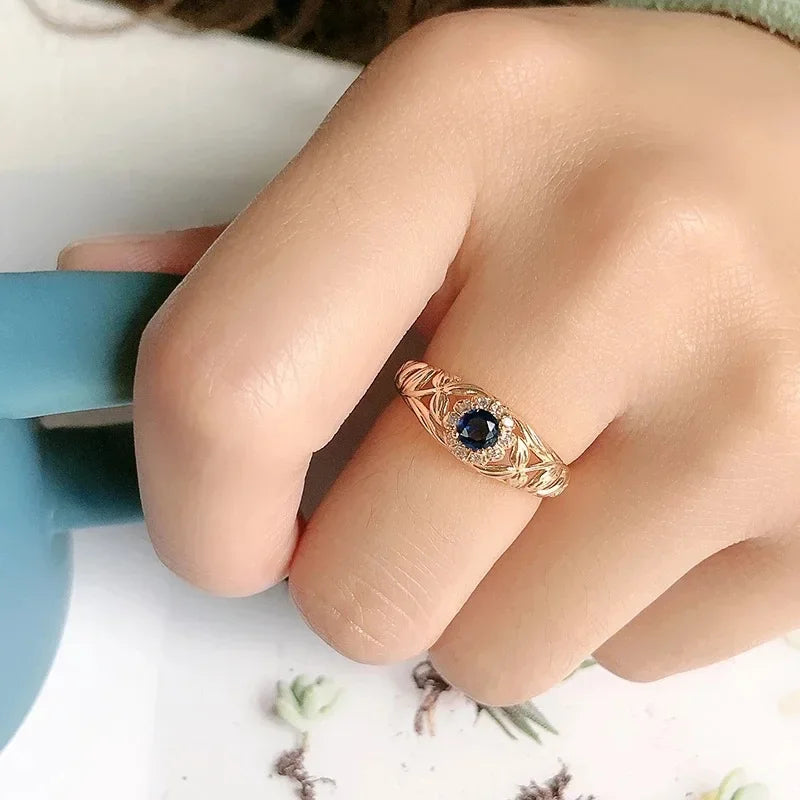 14k gold ring with sparkling diamonds for women, featuring a blue gemstone accent, from Corporación Turística.