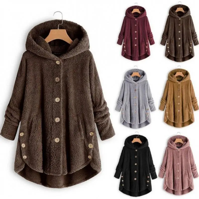 Light blue solid button-up autumn winter coat by Corporación Turística, shown hanging with a cozy, stylish look.