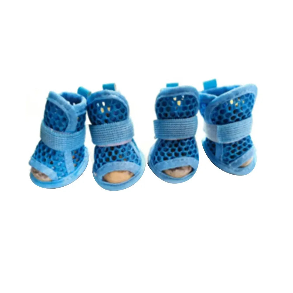 Four pairs of breathable mesh dog shoes in blue, designed for small dogs, from Corporación Turística.