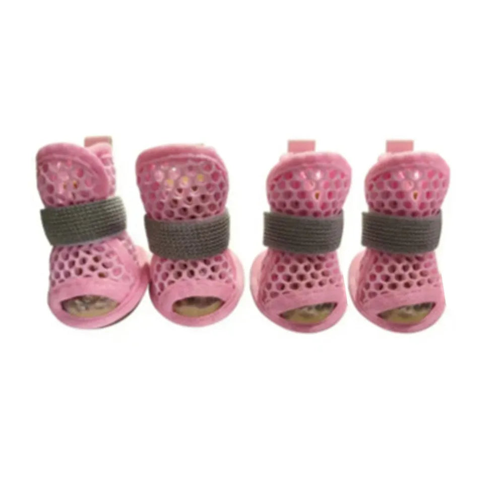 Four pairs of breathable mesh dog shoes in blue from Corporación Turística, designed for small dogs, with visible mesh material and soles.